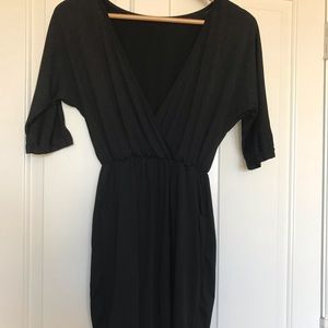 Black low cut dress, hits mid thigh xs